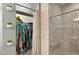 Bathroom featuring a shower with decorative tile and glass, and a closet for storage at 826 Sheen Cir Cir, Haines City, FL 33844