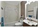 Traditional bathroom with a shower/tub, and a single vanity with large mirror at 826 Sheen Cir Cir, Haines City, FL 33844