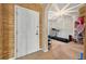 Warm entryway with a view into a multi purpose room with a treadmill and desk at 826 Sheen Cir Cir, Haines City, FL 33844