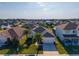 Charming single-story home with a well-manicured lawn, palm trees, and a welcoming front entrance at 826 Sheen Cir Cir, Haines City, FL 33844