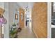 Stylish hallway featuring unique wood plank accent wall and tile flooring at 826 Sheen Cir Cir, Haines City, FL 33844