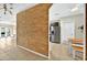 Open-concept design with a distinctive wood accent wall leading to the kitchen at 826 Sheen Cir Cir, Haines City, FL 33844