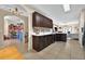 Spacious kitchen with dark wood cabinets, marble countertops, and an open layout, ideal for entertaining at 826 Sheen Cir Cir, Haines City, FL 33844