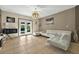 Inviting living room with a view to the patio, a white sofa, and modern lighting at 826 Sheen Cir Cir, Haines City, FL 33844