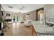 Bright living room with French doors leading to patio and view from kitchen island at 826 Sheen Cir Cir, Haines City, FL 33844