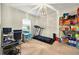 Bright room with desk, treadmill, and storage shelves, offering versatile space at 826 Sheen Cir Cir, Haines City, FL 33844