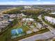 Community aerial view featuring a playground, tennis and basketball courts, with a view of surrounding area at 827 Timber Isle Dr, Orlando, FL 32828