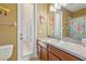 Cheerful bathroom with decorated mirror, single vanity and access to exterior at 827 Timber Isle Dr, Orlando, FL 32828