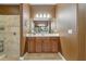 Well-lit bathroom featuring a single vanity and a shower with neutral-colored tile at 827 Timber Isle Dr, Orlando, FL 32828