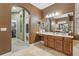 Well-lit bathroom featuring a large vanity, double sinks, and tile flooring at 827 Timber Isle Dr, Orlando, FL 32828