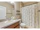 Cozy bathroom featuring a vanity with a sink, mirror, and toilet at 827 Timber Isle Dr, Orlando, FL 32828