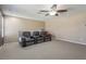 Media room featuring 3-seat leather recliners, a ceiling fan and neutral colored walls at 827 Timber Isle Dr, Orlando, FL 32828