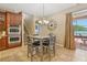 Cozy dining area offering tile floors, a pendant light, and direct access to the outdoor patio at 827 Timber Isle Dr, Orlando, FL 32828