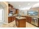 Well-equipped kitchen boasting granite countertops, wooden cabinets, and stainless steel appliances at 827 Timber Isle Dr, Orlando, FL 32828