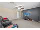 A spacious living room features a ceiling fan, TV and comfortable leather chairs, perfect for relaxing at 827 Timber Isle Dr, Orlando, FL 32828