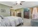 Spacious main bedroom featuring an ensuite bathroom, TV, and access to the outdoor patio at 827 Timber Isle Dr, Orlando, FL 32828