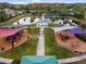 Overhead view of a vibrant community playground with colorful shade structures and play equipment at 827 Timber Isle Dr, Orlando, FL 32828