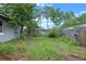 Green backyard with an old wooden fence at 885 Little Bend Rd, Altamonte Springs, FL 32714