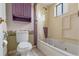 Bathroom with purple accents, a toilet, and a tub-shower combo at 885 Little Bend Rd, Altamonte Springs, FL 32714