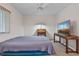 Neutral bedroom with a large television and wooden secretary featuring air mattress bed at 885 Little Bend Rd, Altamonte Springs, FL 32714
