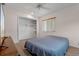 This carpeted bedroom features a window, closet and a queen bed at 885 Little Bend Rd, Altamonte Springs, FL 32714