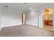 A large bedroom with carpeted floors, closet, and view into attached vanity area at 885 Little Bend Rd, Altamonte Springs, FL 32714
