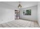Tiled-floor dining room filled with natural light from sliding doors and a window at 885 Little Bend Rd, Altamonte Springs, FL 32714