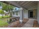 Inviting front porch featuring a decorative swing and a manicured garden at 885 Little Bend Rd, Altamonte Springs, FL 32714