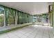 Enclosed lanai with white tile flooring and several windows providing natural light at 885 Little Bend Rd, Altamonte Springs, FL 32714