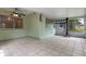 Light-filled sunroom with tile flooring, green walls, and multiple windows at 885 Little Bend Rd, Altamonte Springs, FL 32714