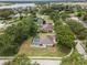 Aerial view of homes with backyard swimming pools in a leafy suburb at 11648 Grand Bay Blvd, Clermont, FL 34711