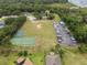 Aerial view of the community recreation area including tennis and basketball courts at 11648 Grand Bay Blvd, Clermont, FL 34711