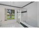 Bright bathroom featuring a tub and separate shower with a large window and natural light at 11648 Grand Bay Blvd, Clermont, FL 34711