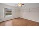 Bedroom with hardwood floors, large window, and white shelving at 11648 Grand Bay Blvd, Clermont, FL 34711