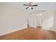 Spacious main bedroom with hardwood floors and ensuite bathroom entrance at 11648 Grand Bay Blvd, Clermont, FL 34711