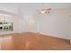 Large living area showcasing vaulted ceilings, hardwood floors and an abundance of space at 11648 Grand Bay Blvd, Clermont, FL 34711