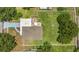 Aerial view of the property showcasing a well-maintained lawn, outdoor seating areas, and surrounding neighborhood at 1208 Baltimore Dr, Orlando, FL 32810