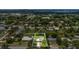 Highlighted aerial view of the home, nestled within a leafy neighborhood and featuring a spacious, enclosed backyard at 1208 Baltimore Dr, Orlando, FL 32810
