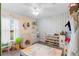 room with dinosaur decor, play tent and fun storage shelving at 122 Seville Rd, Auburndale, FL 33823