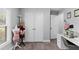 Open bedroom with view of a closet and sewing area with flowers at 122 Seville Rd, Auburndale, FL 33823