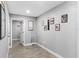Cozy hallway with light gray walls and wood-look flooring that can be used as an office or flex space at 122 Seville Rd, Auburndale, FL 33823