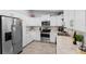 Modern kitchen featuring stainless steel appliances, white cabinets, and granite countertops, ready for culinary adventures at 122 Seville Rd, Auburndale, FL 33823