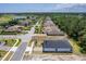 Aerial view of new single-Gathering homes under construction in a lakeside golf community at 1249 Champions Dr, Daytona Beach, FL 32124
