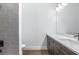 Modern bathroom features sleek vanity, stylish fixtures, and attractive gray tiled wall at 1249 Champions Dr, Daytona Beach, FL 32124