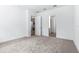 Carpeted bedroom showing the entry doors and connections to other rooms in the house at 1249 Champions Dr, Daytona Beach, FL 32124