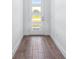 Clean entryway featuring contemporary wood-look tile flooring and natural light at 1249 Champions Dr, Daytona Beach, FL 32124
