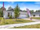 This attractive single-Gathering home features a well-maintained lawn and a two-car garage at 1249 Champions Dr, Daytona Beach, FL 32124