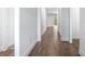 Bright hallway features stylish wood-look flooring and freshly painted white walls at 1249 Champions Dr, Daytona Beach, FL 32124