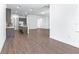 Open concept kitchen with stainless steel appliances and central island flows into living area at 1249 Champions Dr, Daytona Beach, FL 32124