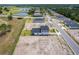 New home showcasing a lush lawn and covered patio in a community near a golf course and scenic pond at 1262 Champions Dr, Daytona Beach, FL 32124